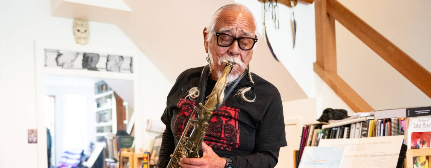 José Cuéllar plays the saxophone at his home in San Francisco