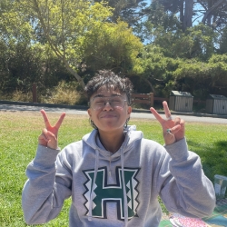 student in UH Manoa sweater